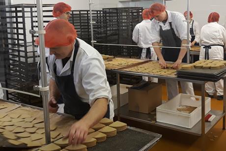 Staff picking up oatcakes cropped