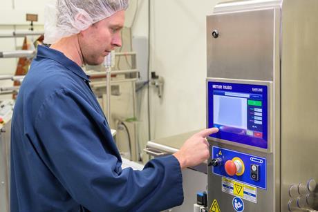 Man using a tech device, used for checking food contamination